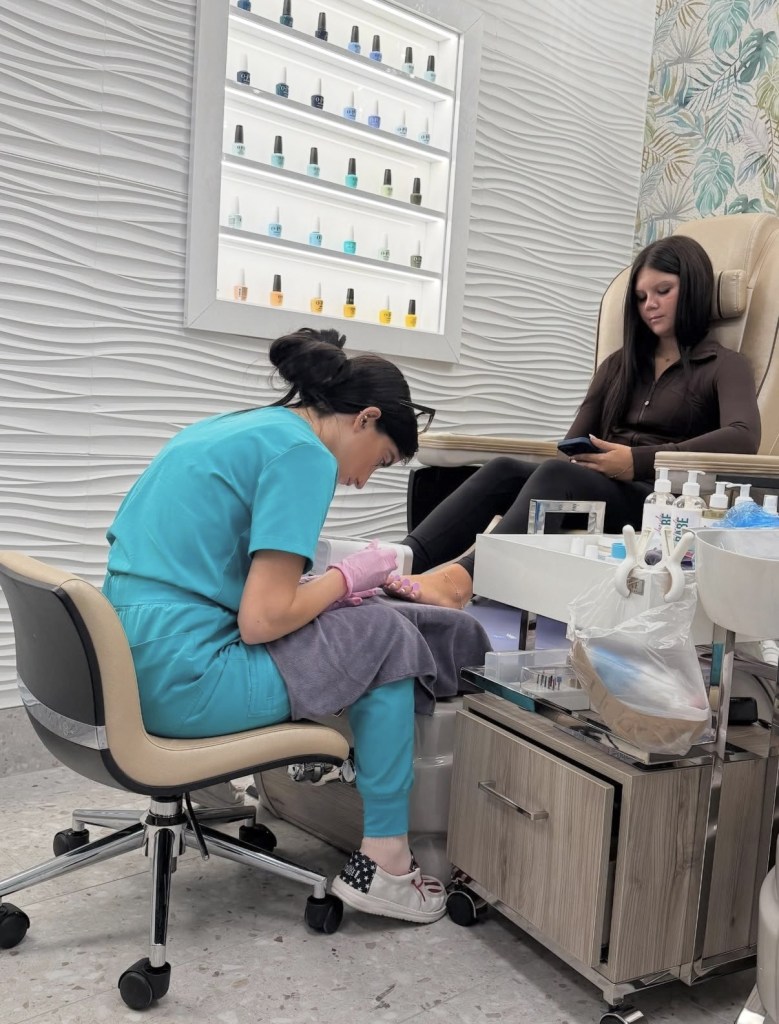 student doing pedicure service
